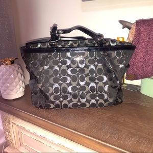 Black and silver coach purse